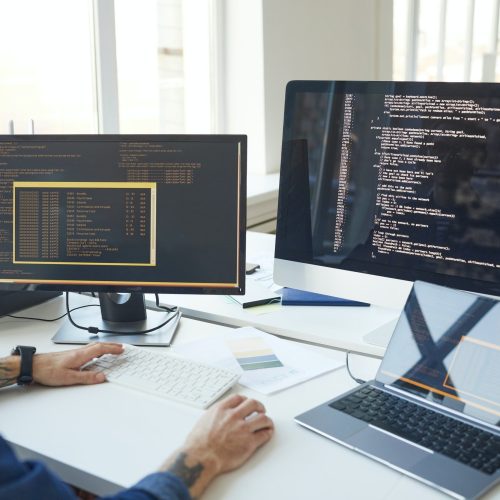 it-programmer-writing-code-on-computer-screen.jpg
